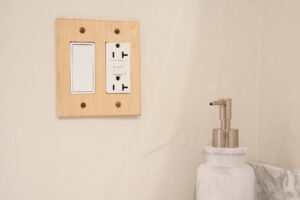 maple 2 gang decorator wall plate in bathroom